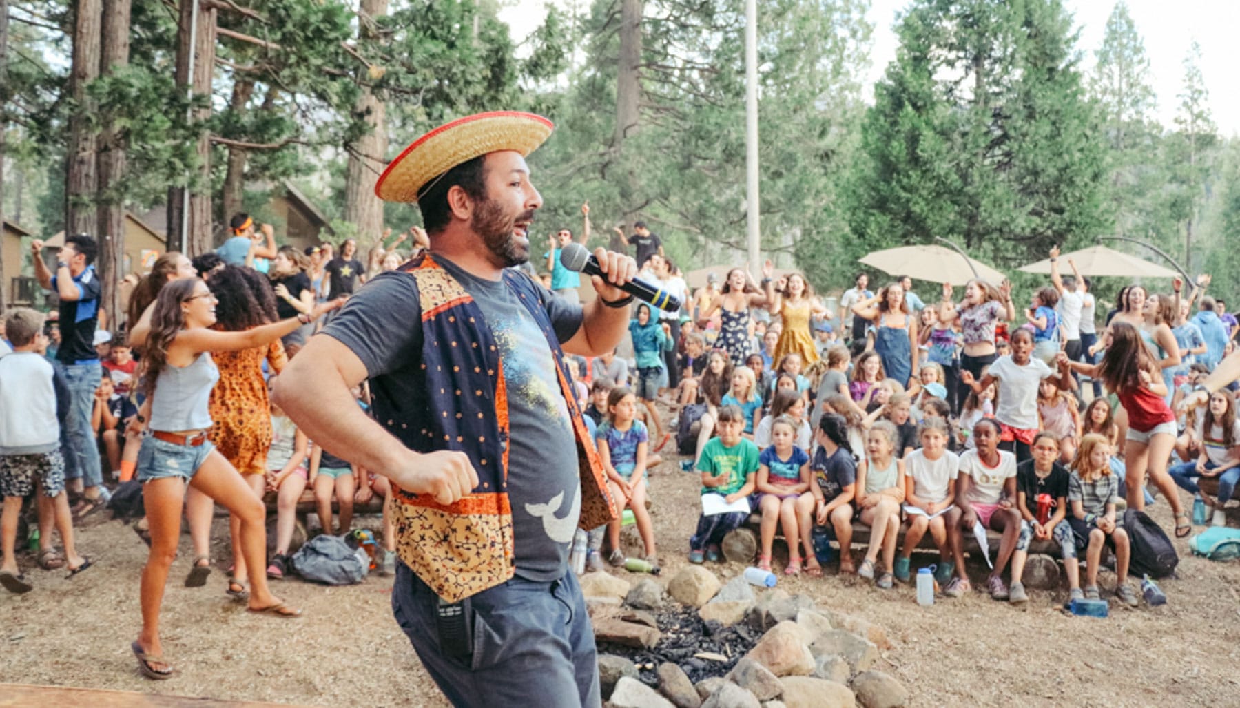 Tawonga staff speaking to crowd of campers at an all-camp activity