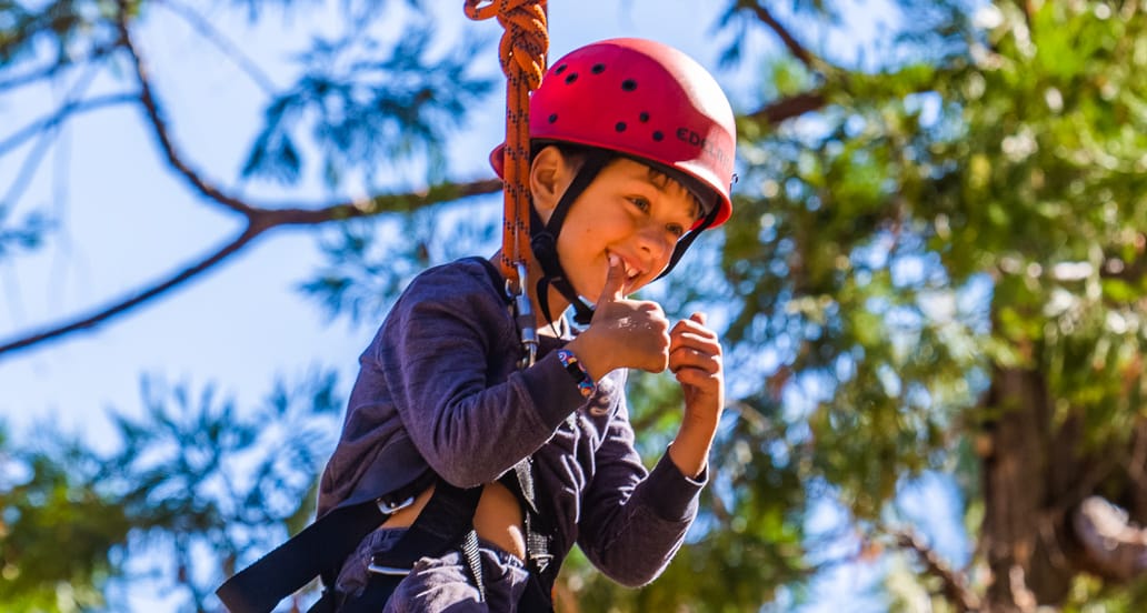 Boy on challenge course