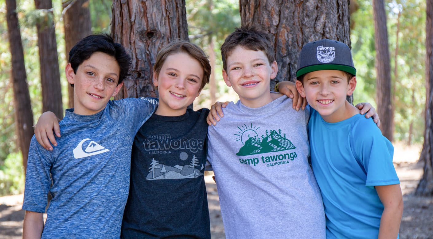 Four boys smiling
