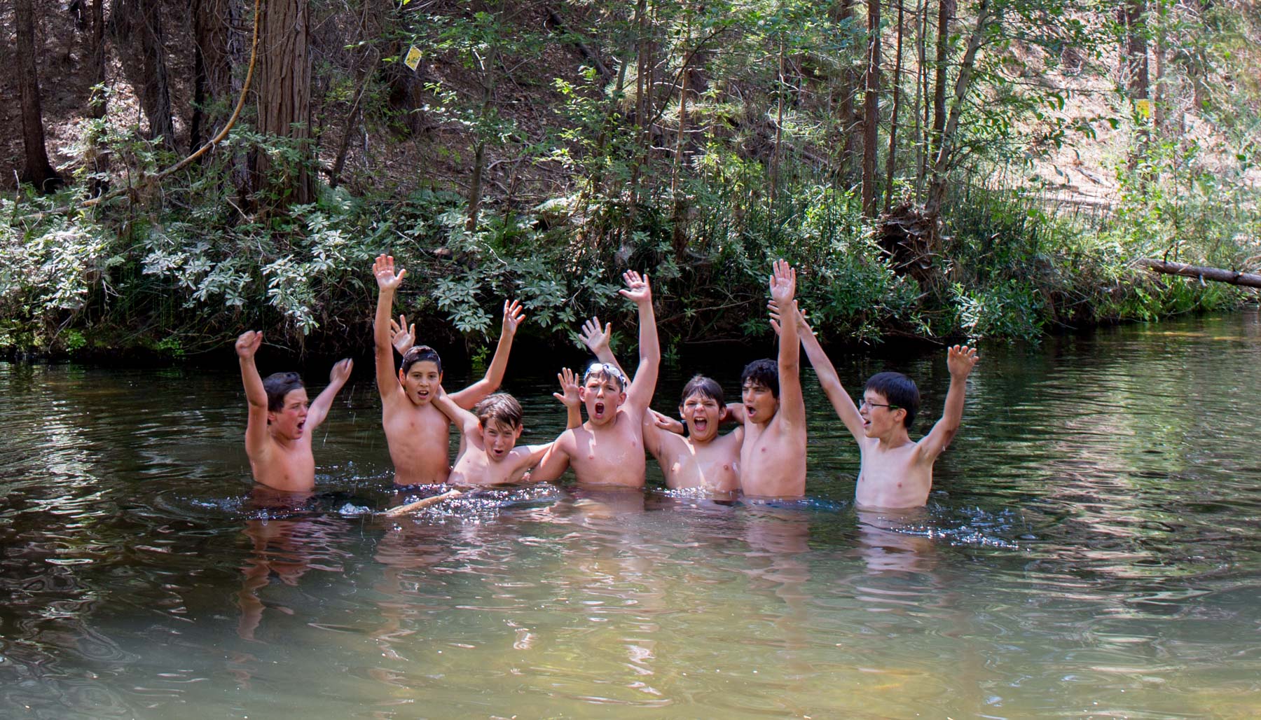 Boys swimming in the river