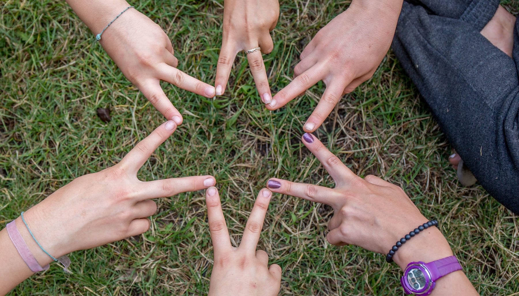 Kids making Star of David from hands