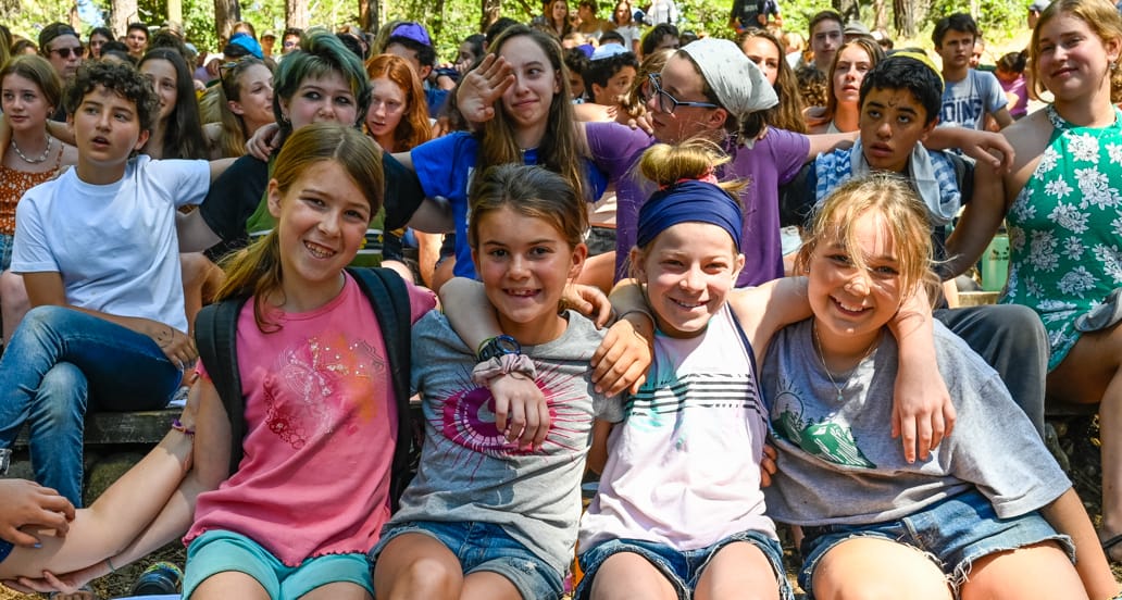 Four girls celebrating Judaism at camp