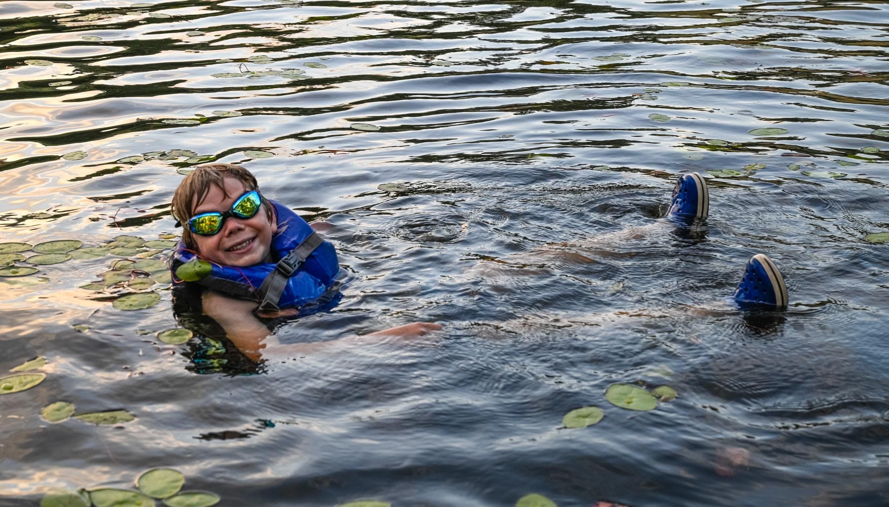 Boy swimming in the lake