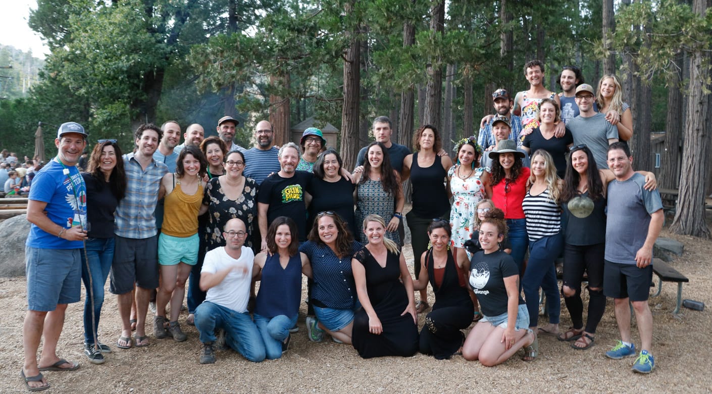 Group of alumni smiling at Camp Tawonga