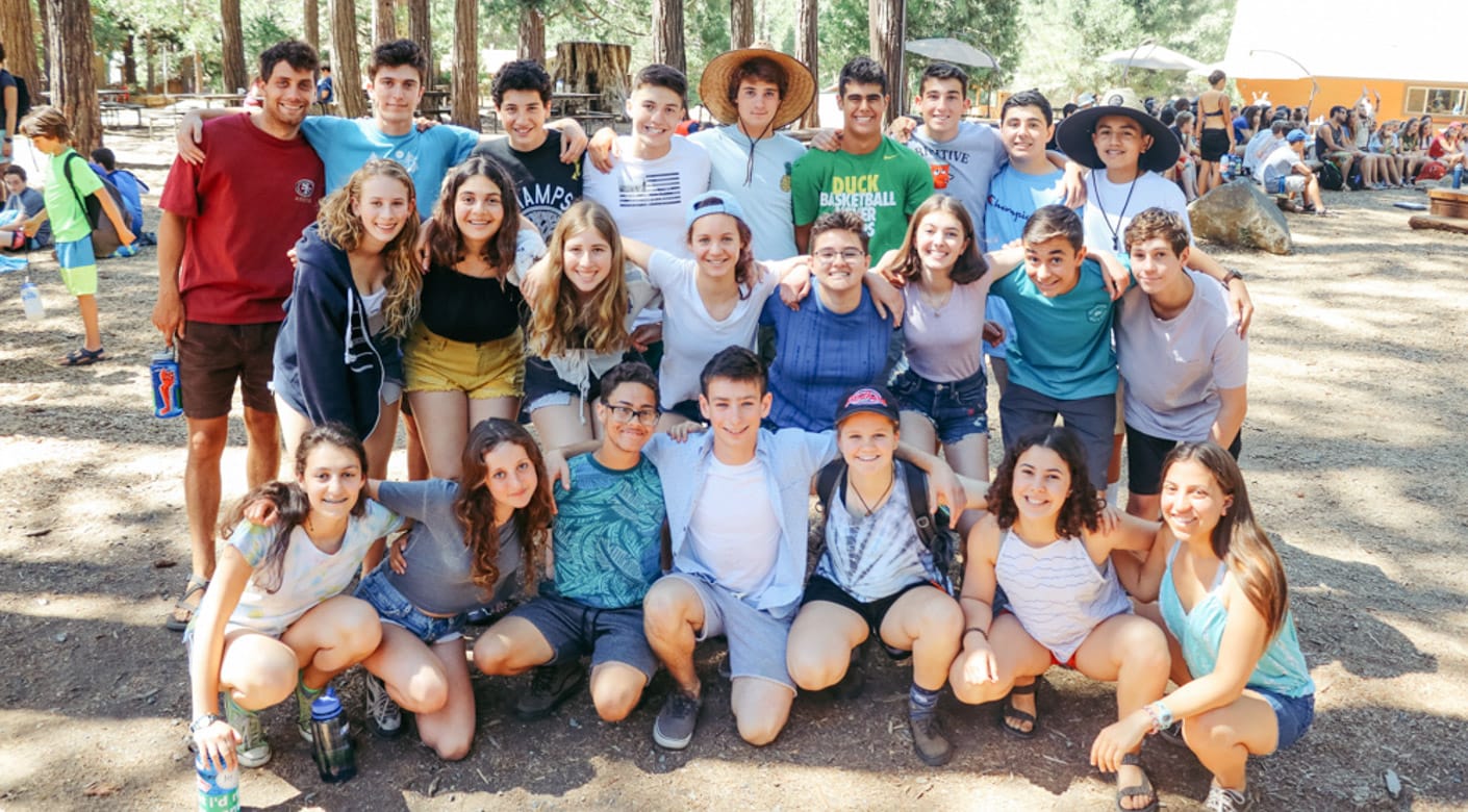 Teens posing for a group photo at Teen Leadership program