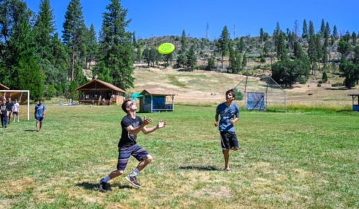 Campers playing frisbee