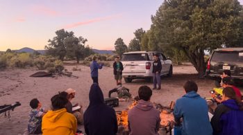Campfire at sunset on the Rock and River quest
