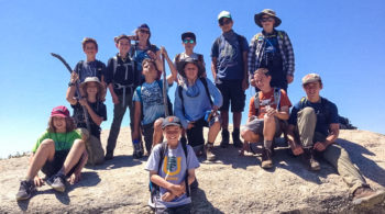 Hikers on rocks on the Sierra Slam quest
