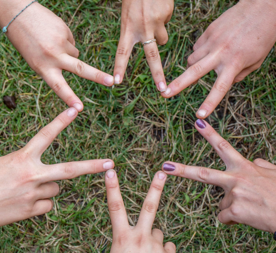 Campers making Star of David with their hands