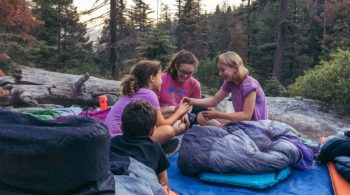 Campers on Taste of Quest in sleeping bags