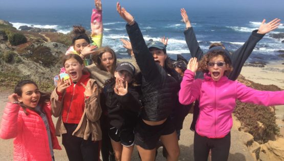 Teens by the coast on the Women of the Wild quest